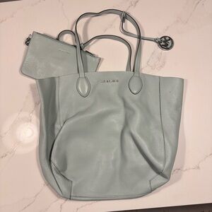 Light blue and silver reversible Michael Kors tote with matching wallet pouch